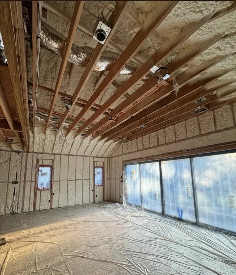 Interior walls and ceiling insulated with spray foam during new construction in Hanford